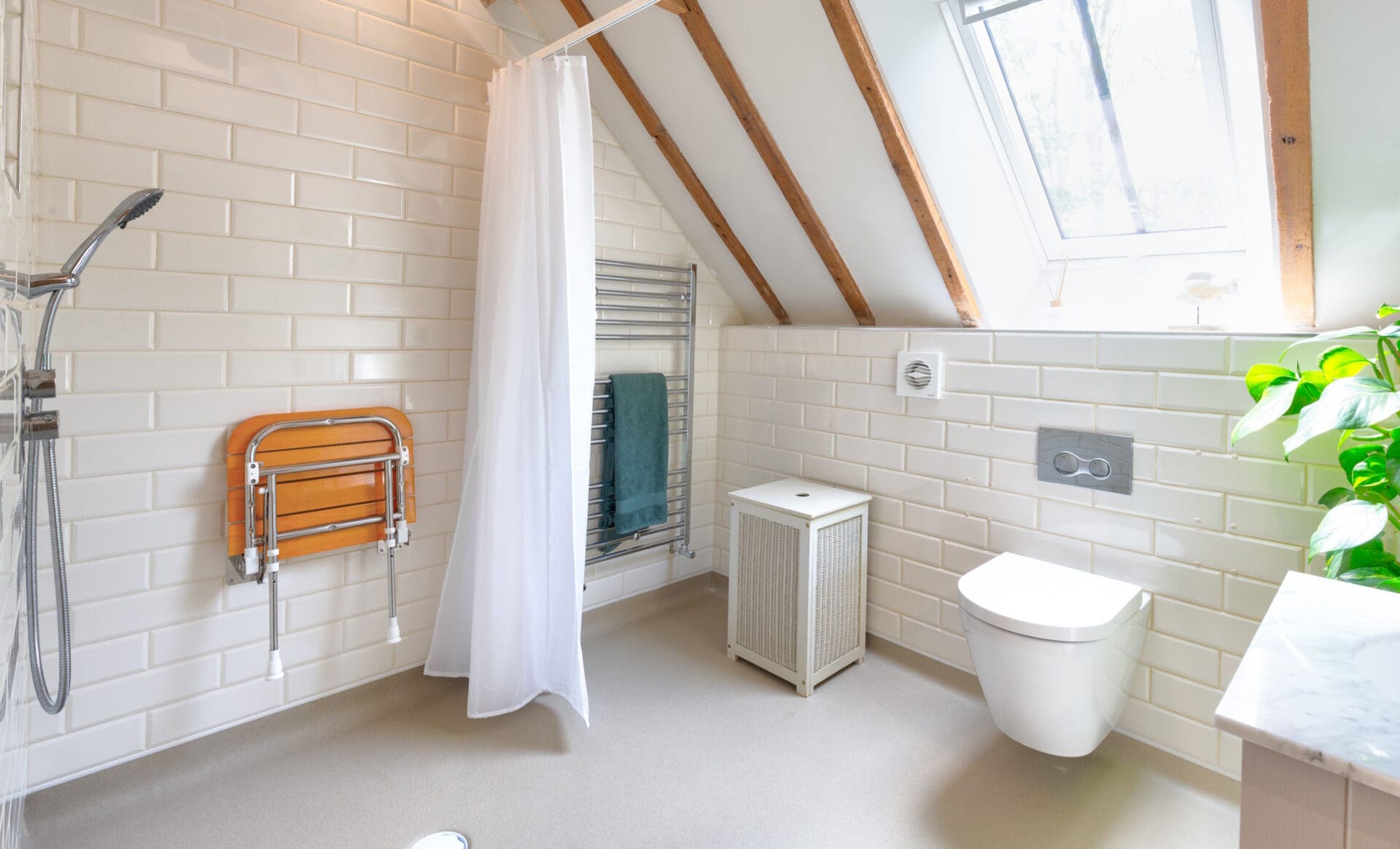 Photo of a luxurious accessible wet room sensitively designed and installed in a beautiful barn conversion