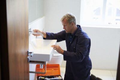 Bathroom Fitter Fitting A Sink