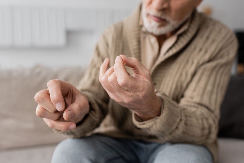 Partial View Of Aged Man With Parkinson Disease And Trembling Ha