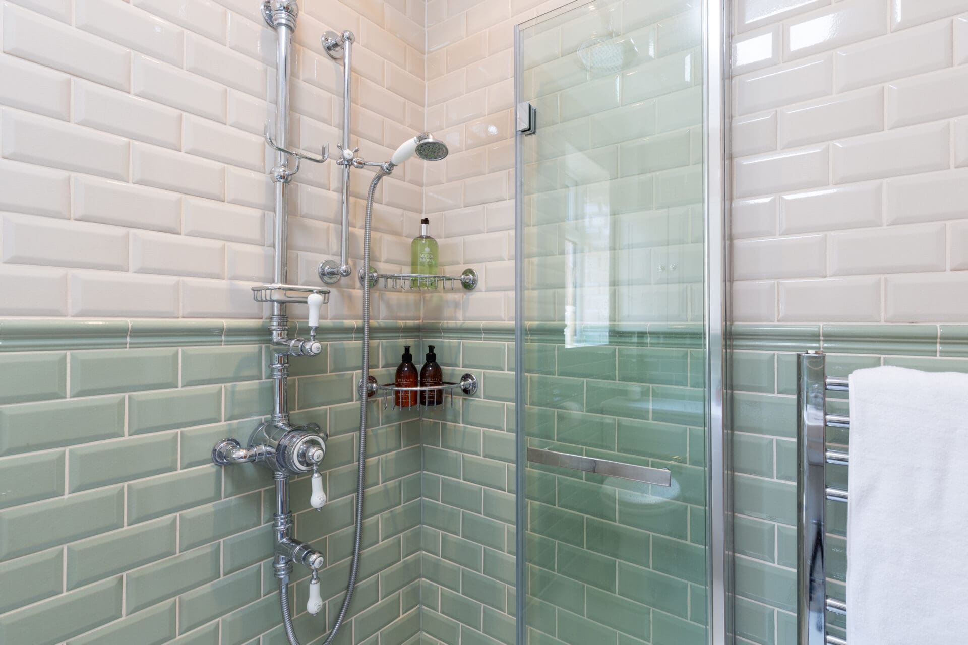 Photo of a luxury accessible shower room with period-style fixtures and tiles 