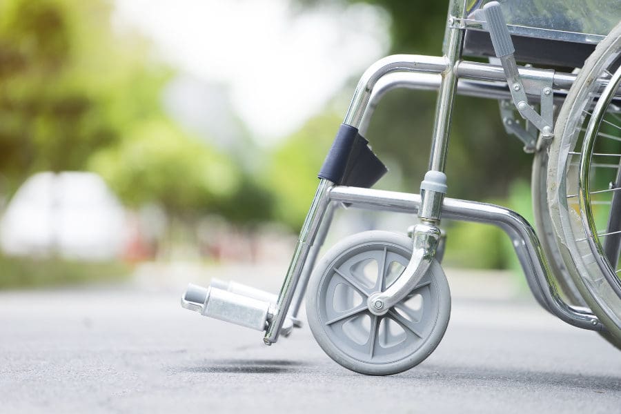 Empty wheelchair parked in hospital