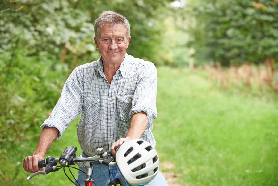 man enjoying bike ride in countryside