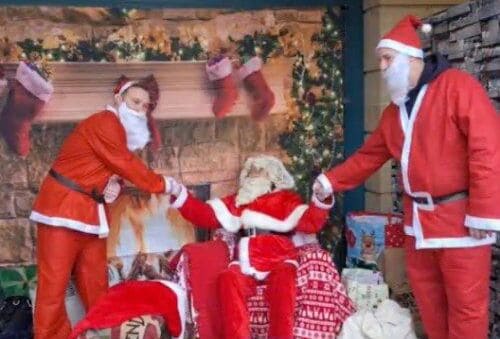 Ads Christmas Event, 3 Santas Smiling And Shaking Hands (1)