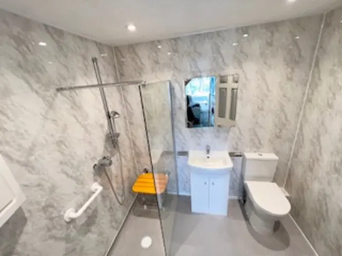 Mr And Mrs B's Bathroom Post Renovation Walk In Shower With Grab Rails And Seat With Non Slip Flooring And Modern Wash Basin