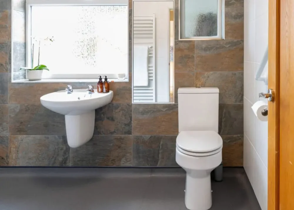 Mr And Mrs H's Wet Room After Conversion Anti Slip Flooring Around Toilet, With Sink, Large Window And Mirror