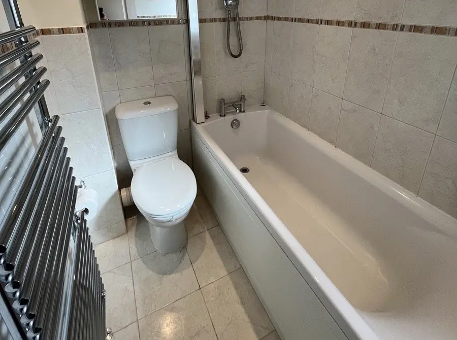 Mr And Mrs S Bathroom Before Renovation A Full Length Bath With No Accessble Entry Option, Toilet, And Towel Rail