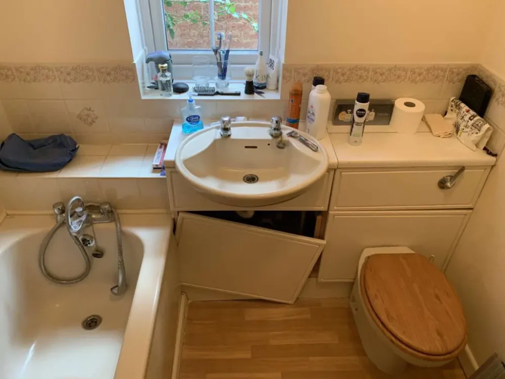 Mrs Dean's Bathroom Before Renovation A Crowded Room With Non Accessible Bath, Broken Cupboards And Sink