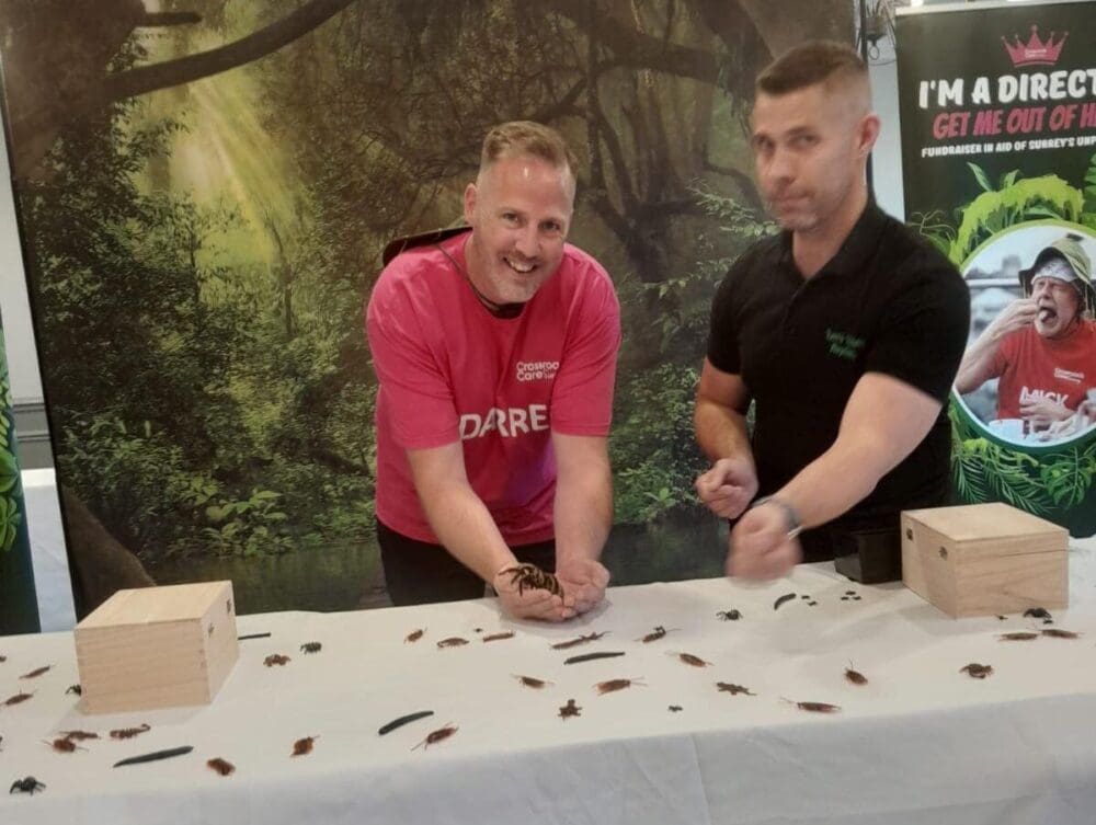 Absolute Mobility Director At A Stall Holding A Spider