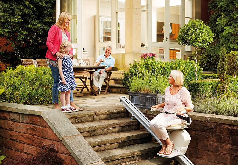 Lady Using An Outdoor Stairlift